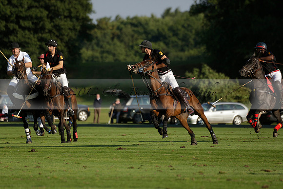 Pluma Negra (white) v Shoreline (black) in the Brecknock Cup Subsidiary final polo match played on Sunday 25 August 2013 at Cowdray Park Polo Club on Ambersham 1. 2013.10.12 www.polopictures.co.uk