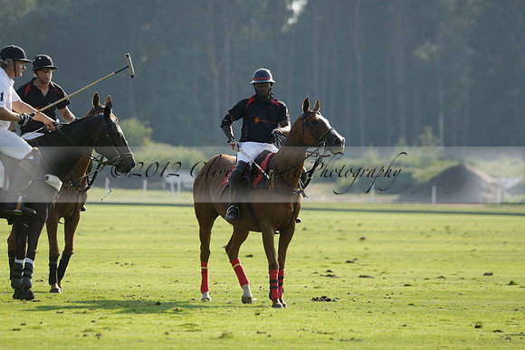 Pluma Negra (white) v Shoreline (black) in the Brecknock Cup Subsidiary final polo match played on Sunday 25 August 2013 at Cowdray Park Polo Club on Ambersham 1. 2013.10.12 www.polopictures.co.uk