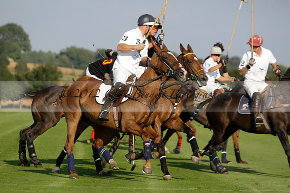 Pluma Negra (white) v Shoreline (black) in the Brecknock Cup Subsidiary final polo match played on Sunday 25 August 2013 at Cowdray Park Polo Club on Ambersham 1. 2013.10.12 www.polopictures.co.uk