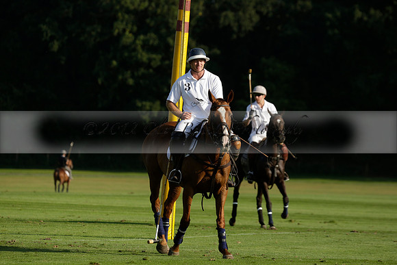 Pluma Negra (white) v Shoreline (black) in the Brecknock Cup Subsidiary final polo match played on Sunday 25 August 2013 at Cowdray Park Polo Club on Ambersham 1. 2013.10.12 www.polopictures.co.uk