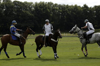 Combe Place (blue) v Silver Fox (white) in a Park House West Sussex Cup Polo match on Ambersham 1 at Cowdray Park Polo Club on Friday 30 August 2013. 2013.08.30 www.polopictures.co.uk