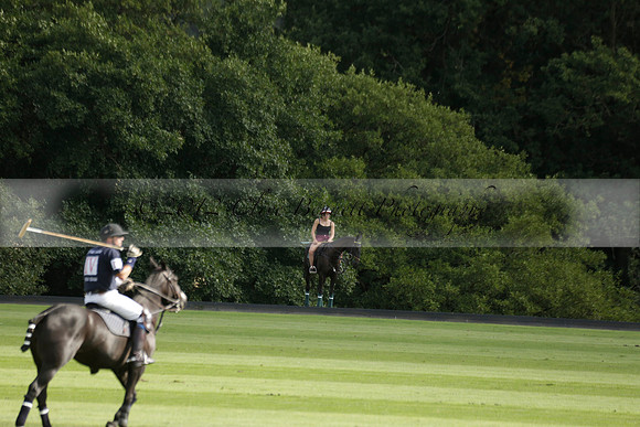 Pandas (white) v Home Farm (navy) in a Park House West Sussex Cup Polo match on Brooksfield at Cowdray Park Polo Club on Friday 30 August 2013. 2013.08.30 www.polopictures.co.uk