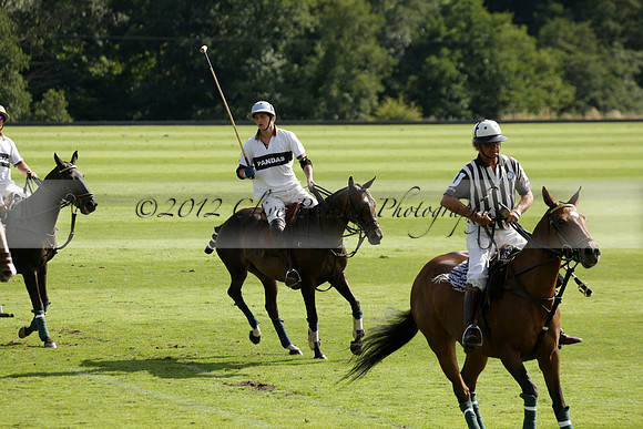 Pandas (white) v Home Farm (navy) in a Park House West Sussex Cup Polo match on Brooksfield at Cowdray Park Polo Club on Friday 30 August 2013. 2013.08.30 www.polopictures.co.uk