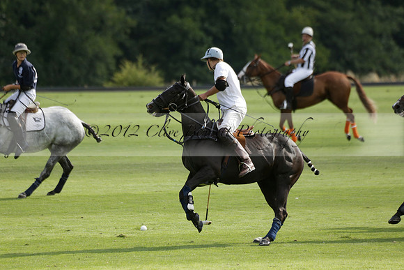 Pandas (white) v Home Farm (navy) in a Park House West Sussex Cup Polo match on Brooksfield at Cowdray Park Polo Club on Friday 30 August 2013. 2013.08.30 www.polopictures.co.uk