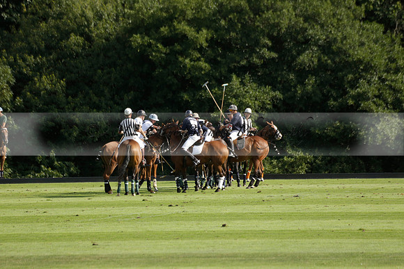 Pandas (white) v Home Farm (navy) in a Park House West Sussex Cup Polo match on Brooksfield at Cowdray Park Polo Club on Friday 30 August 2013. 2013.08.30 www.polopictures.co.uk