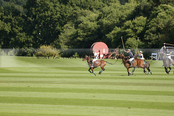 Pandas (white) v Home Farm (navy) in a Park House West Sussex Cup Polo match on Brooksfield at Cowdray Park Polo Club on Friday 30 August 2013. 2013.08.30 www.polopictures.co.uk