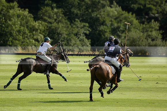 Pandas (white) v Home Farm (navy) in a Park House West Sussex Cup Polo match on Brooksfield at Cowdray Park Polo Club on Friday 30 August 2013. 2013.08.30 www.polopictures.co.uk