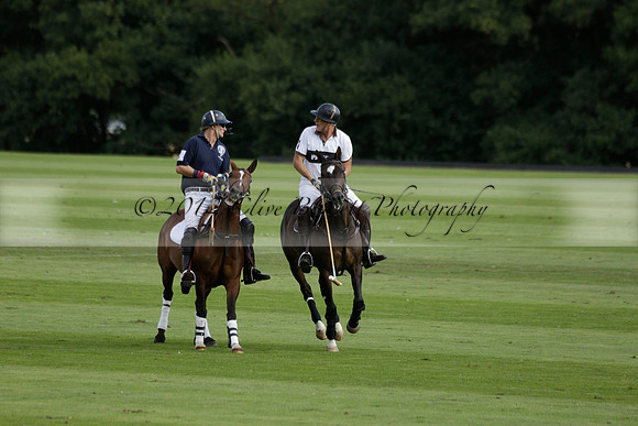 Pandas (white) v Home Farm (navy) in a Park House West Sussex Cup Polo match on Brooksfield at Cowdray Park Polo Club on Friday 30 August 2013. 2013.08.30 www.polopictures.co.uk