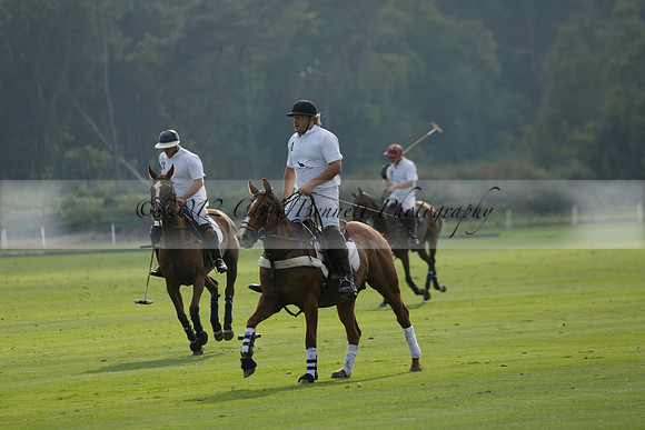 Pluma Negra (white) v Shoreline (black) in the Brecknock Cup Subsidiary final polo match played on Sunday 25 August 2013 at Cowdray Park Polo Club on Ambersham 1. 2013.10.12 www.polopictures.co.uk