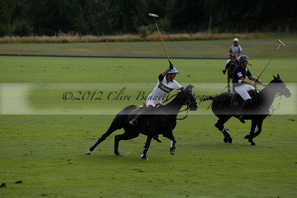 Pandas (white) v Home Farm (navy) in a Park House West Sussex Cup Polo match on Brooksfield at Cowdray Park Polo Club on Friday 30 August 2013. 2013.08.30 www.polopictures.co.uk