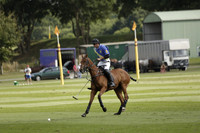 Combe Place (blue) v Silver Fox (white) in a Park House West Sussex Cup Polo match on Ambersham 1 at Cowdray Park Polo Club on Friday 30 August 2013. 2013.08.30 www.polopictures.co.uk