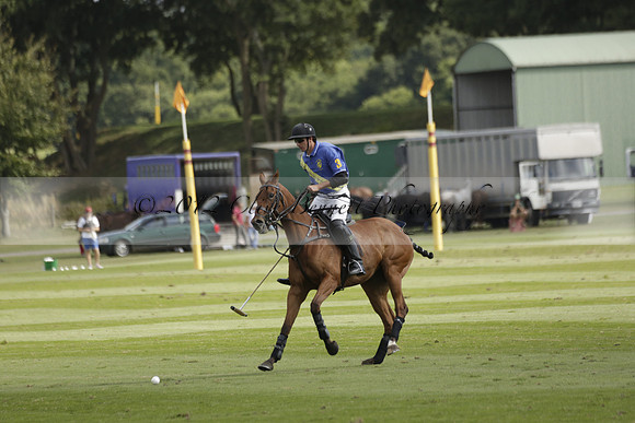 Combe Place (blue) v Silver Fox (white) in a Park House West Sussex Cup Polo match on Ambersham 1 at Cowdray Park Polo Club on Friday 30 August 2013. 2013.08.30 www.polopictures.co.uk