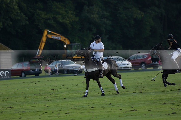 Pluma Negra (white) v Shoreline (black) in the Brecknock Cup Subsidiary final polo match played on Sunday 25 August 2013 at Cowdray Park Polo Club on Ambersham 1. 2013.10.12 www.polopictures.co.uk