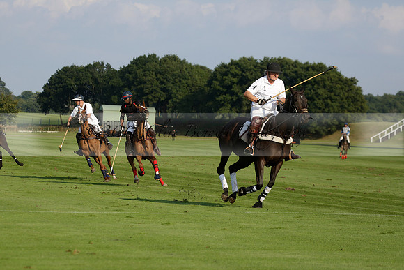 Pluma Negra (white) v Shoreline (black) in the Brecknock Cup Subsidiary final polo match played on Sunday 25 August 2013 at Cowdray Park Polo Club on Ambersham 1. 2013.10.12 www.polopictures.co.uk