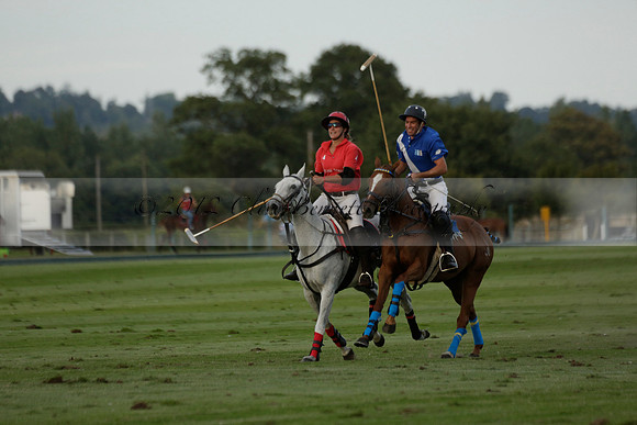Ghost Chilli (blue) v Team Tonic (red) in a Lodsworth Cup Polo match on Ambersham 3 at Cowdray Park Polo Club on Friday 30 August 2013. 2013.08.30 www.polopictures.co.uk