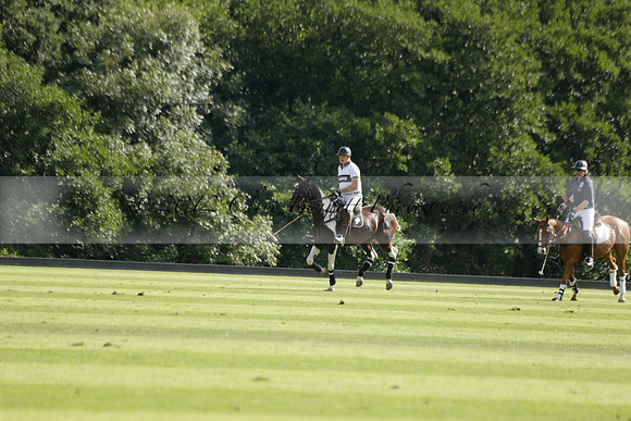 Pandas (white) v Home Farm (navy) in a Park House West Sussex Cup Polo match on Brooksfield at Cowdray Park Polo Club on Friday 30 August 2013. 2013.08.30 www.polopictures.co.uk