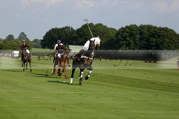 Pluma Negra (white) v Shoreline (black) in the Brecknock Cup Subsidiary final polo match played on Sunday 25 August 2013 at Cowdray Park Polo Club on Ambersham 1. 2013.10.12 www.polopictures.co.uk