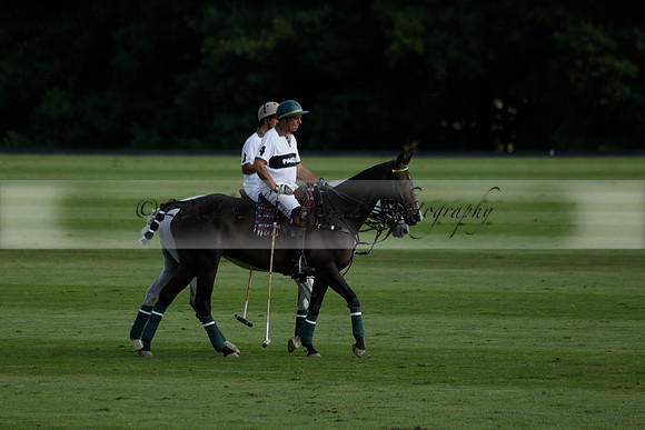 Pandas (white) v Home Farm (navy) in a Park House West Sussex Cup Polo match on Brooksfield at Cowdray Park Polo Club on Friday 30 August 2013. 2013.08.30 www.polopictures.co.uk