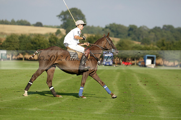 Pluma Negra (white) v Shoreline (black) in the Brecknock Cup Subsidiary final polo match played on Sunday 25 August 2013 at Cowdray Park Polo Club on Ambersham 1. 2013.10.12 www.polopictures.co.uk