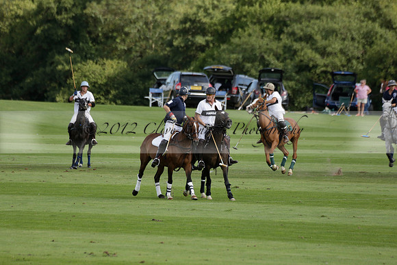 Pandas (white) v Home Farm (navy) in a Park House West Sussex Cup Polo match on Brooksfield at Cowdray Park Polo Club on Friday 30 August 2013. 2013.08.30 www.polopictures.co.uk
