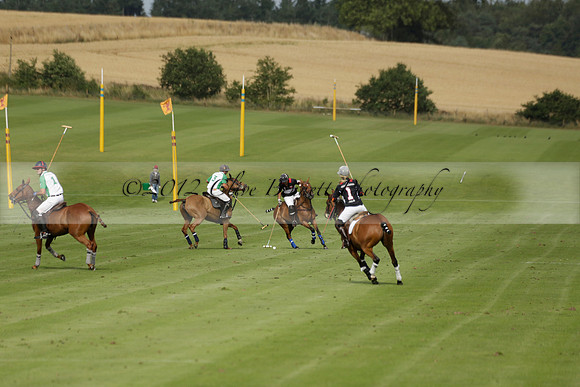 Jaeger Le Coultre (black)  v Wairakei Pastoral (white) in a Jaeger Le Coultre Holden White Cup polo match played on 29 July 2013 at Cowdray Park Polo Club on Brooksfieldwww.polopictures.co.uk