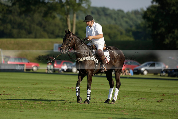 Pluma Negra (white) v Shoreline (black) in the Brecknock Cup Subsidiary final polo match played on Sunday 25 August 2013 at Cowdray Park Polo Club on Ambersham 1. 2013.10.12 www.polopictures.co.uk