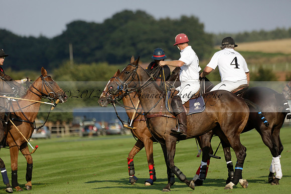 Pluma Negra (white) v Shoreline (black) in the Brecknock Cup Subsidiary final polo match played on Sunday 25 August 2013 at Cowdray Park Polo Club on Ambersham 1. 2013.10.12 www.polopictures.co.uk