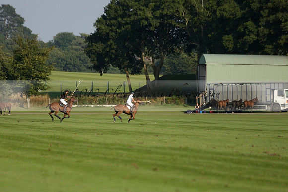 Pluma Negra (white) v Shoreline (black) in the Brecknock Cup Subsidiary final polo match played on Sunday 25 August 2013 at Cowdray Park Polo Club on Ambersham 1. 2013.10.12 www.polopictures.co.uk