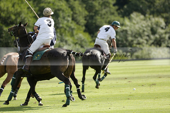 Pandas (white) v Home Farm (navy) in a Park House West Sussex Cup Polo match on Brooksfield at Cowdray Park Polo Club on Friday 30 August 2013. 2013.08.30 www.polopictures.co.uk