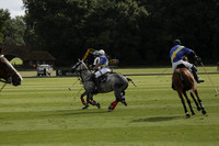 Combe Place (blue) v Silver Fox (white) in a Park House West Sussex Cup Polo match on Ambersham 1 at Cowdray Park Polo Club on Friday 30 August 2013. 2013.08.30 www.polopictures.co.uk