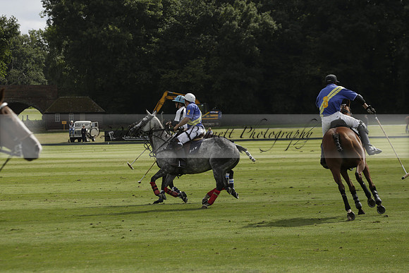 Combe Place (blue) v Silver Fox (white) in a Park House West Sussex Cup Polo match on Ambersham 1 at Cowdray Park Polo Club on Friday 30 August 2013. 2013.08.30 www.polopictures.co.uk