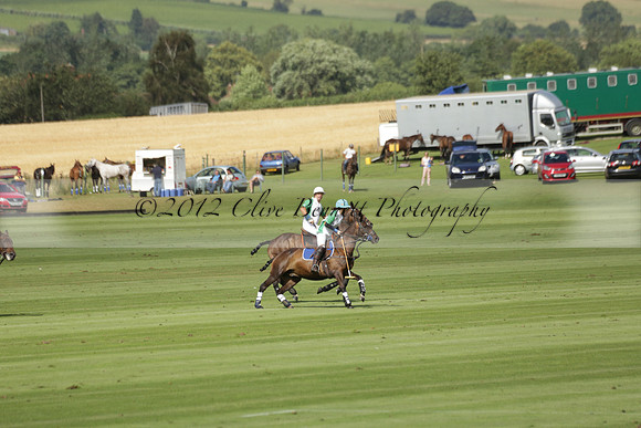Jaeger Le Coultre (black)  v Wairakei Pastoral (white) in a Jaeger Le Coultre Holden White Cup polo match played on 29 July 2013 at Cowdray Park Polo Club on Brooksfieldwww.polopictures.co.uk