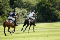 Pandas (white) v Home Farm (navy) in a Park House West Sussex Cup Polo match on Brooksfield at Cowdray Park Polo Club on Friday 30 August 2013. 2013.08.30 www.polopictures.co.uk