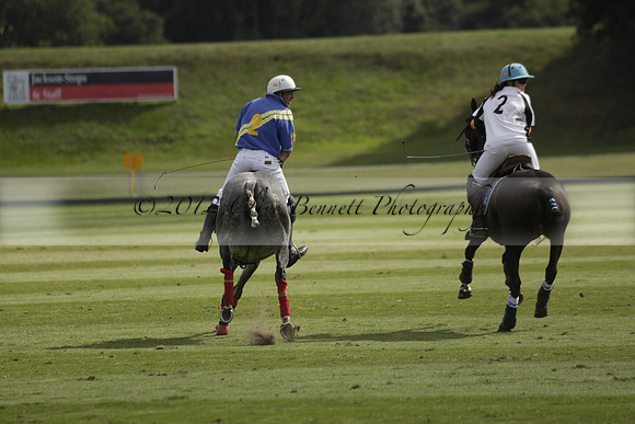 Combe Place (blue) v Silver Fox (white) in a Park House West Sussex Cup Polo match on Ambersham 1 at Cowdray Park Polo Club on Friday 30 August 2013. 2013.08.30 www.polopictures.co.uk