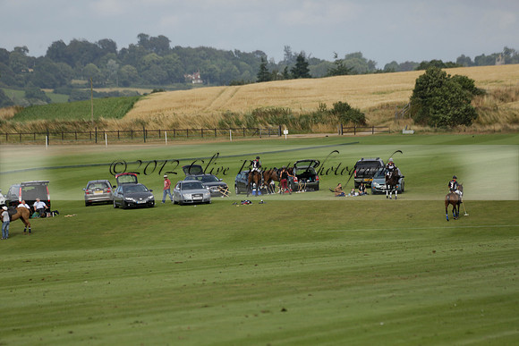 Jaeger Le Coultre (black)  v Wairakei Pastoral (white) in a Jaeger Le Coultre Holden White Cup polo match played on 29 July 2013 at Cowdray Park Polo Club on Brooksfieldwww.polopictures.co.uk