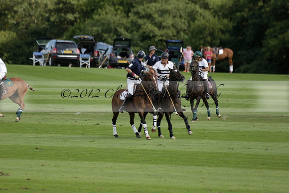 Pandas (white) v Home Farm (navy) in a Park House West Sussex Cup Polo match on Brooksfield at Cowdray Park Polo Club on Friday 30 August 2013. 2013.08.30 www.polopictures.co.uk