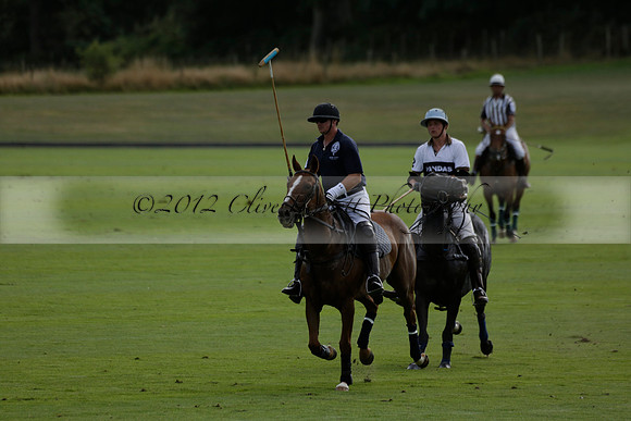 Pandas (white) v Home Farm (navy) in a Park House West Sussex Cup Polo match on Brooksfield at Cowdray Park Polo Club on Friday 30 August 2013. 2013.08.30 www.polopictures.co.uk