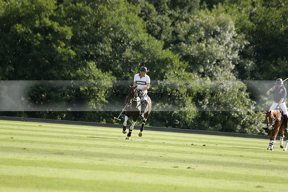 Pandas (white) v Home Farm (navy) in a Park House West Sussex Cup Polo match on Brooksfield at Cowdray Park Polo Club on Friday 30 August 2013. 2013.08.30 www.polopictures.co.uk