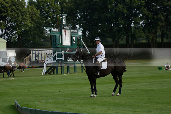 Pluma Negra (white) v Shoreline (black) in the Brecknock Cup Subsidiary final polo match played on Sunday 25 August 2013 at Cowdray Park Polo Club on Ambersham 1. 2013.10.12 www.polopictures.co.uk