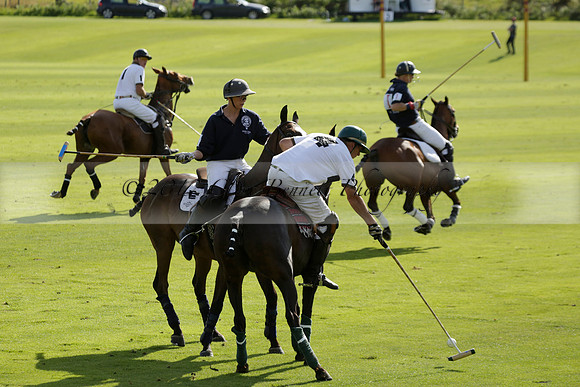 Pandas (white) v Home Farm (navy) in a Park House West Sussex Cup Polo match on Brooksfield at Cowdray Park Polo Club on Friday 30 August 2013. 2013.08.30 www.polopictures.co.uk