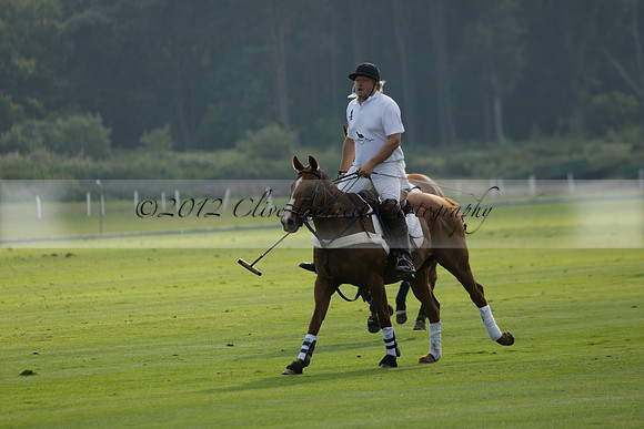 Pluma Negra (white) v Shoreline (black) in the Brecknock Cup Subsidiary final polo match played on Sunday 25 August 2013 at Cowdray Park Polo Club on Ambersham 1. 2013.10.12 www.polopictures.co.uk