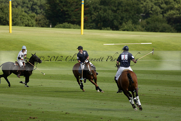 Pandas (white) v Home Farm (navy) in a Park House West Sussex Cup Polo match on Brooksfield at Cowdray Park Polo Club on Friday 30 August 2013. 2013.08.30 www.polopictures.co.uk