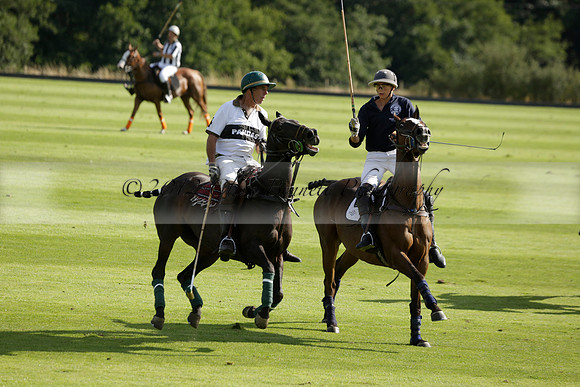 Pandas (white) v Home Farm (navy) in a Park House West Sussex Cup Polo match on Brooksfield at Cowdray Park Polo Club on Friday 30 August 2013. 2013.08.30 www.polopictures.co.uk