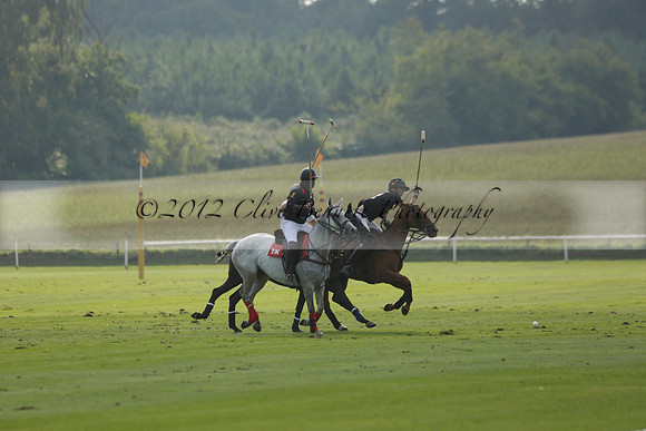 Pluma Negra (white) v Shoreline (black) in the Brecknock Cup Subsidiary final polo match played on Sunday 25 August 2013 at Cowdray Park Polo Club on Ambersham 1. 2013.10.12 www.polopictures.co.uk