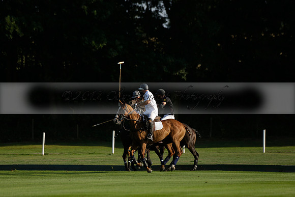 Pluma Negra (white) v Shoreline (black) in the Brecknock Cup Subsidiary final polo match played on Sunday 25 August 2013 at Cowdray Park Polo Club on Ambersham 1. 2013.10.12 www.polopictures.co.uk
