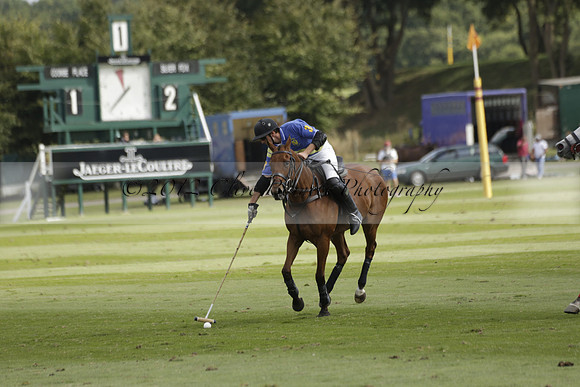 Combe Place (blue) v Silver Fox (white) in a Park House West Sussex Cup Polo match on Ambersham 1 at Cowdray Park Polo Club on Friday 30 August 2013. 2013.08.30 www.polopictures.co.uk