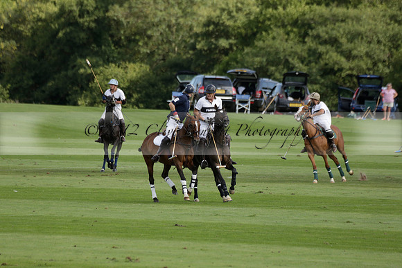 Pandas (white) v Home Farm (navy) in a Park House West Sussex Cup Polo match on Brooksfield at Cowdray Park Polo Club on Friday 30 August 2013. 2013.08.30 www.polopictures.co.uk