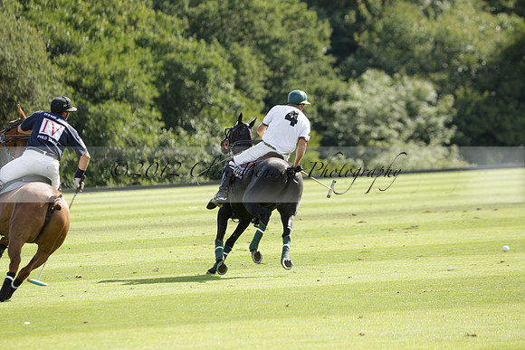 Pandas (white) v Home Farm (navy) in a Park House West Sussex Cup Polo match on Brooksfield at Cowdray Park Polo Club on Friday 30 August 2013. 2013.08.30 www.polopictures.co.uk