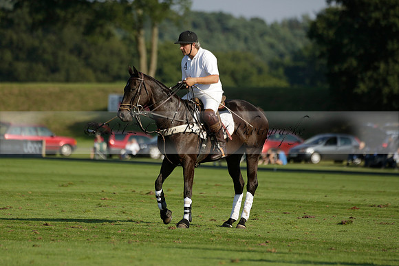 Pluma Negra (white) v Shoreline (black) in the Brecknock Cup Subsidiary final polo match played on Sunday 25 August 2013 at Cowdray Park Polo Club on Ambersham 1. 2013.10.12 www.polopictures.co.uk