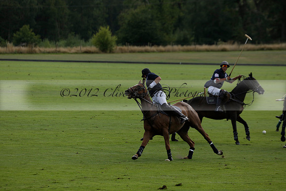 Pandas (white) v Home Farm (navy) in a Park House West Sussex Cup Polo match on Brooksfield at Cowdray Park Polo Club on Friday 30 August 2013. 2013.08.30 www.polopictures.co.uk